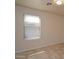 Simple bedroom with a window and neutral walls at 6709 W Luke Ave, Glendale, AZ 85303