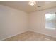Spacious bedroom with tile floors and large window at 6709 W Luke Ave, Glendale, AZ 85303