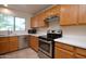 Kitchen with stainless steel appliances and oak cabinets at 6709 W Luke Ave, Glendale, AZ 85303
