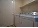 Laundry room with washer, dryer and shelving at 6709 W Luke Ave, Glendale, AZ 85303