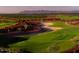 Aerial view of a golf course with beautiful mountain views at 7674 W Cactus Wren Way, Florence, AZ 85132