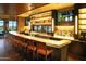 Modern bar with a long counter and comfortable seating at 7674 W Cactus Wren Way, Florence, AZ 85132