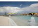 Resort-style pool with fountains and yellow umbrellas at 7674 W Cactus Wren Way, Florence, AZ 85132