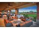 Spacious outdoor patio with comfortable seating and golf course views at 7674 W Cactus Wren Way, Florence, AZ 85132