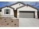 Attractive single-story home with a two-car garage and desert landscaping at 8270 W Mantle Way, Florence, AZ 85132