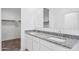 Double vanity bathroom with granite countertops and modern fixtures at 8391 W Mantle Way, Florence, AZ 85132