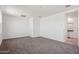 Spacious bedroom with carpet and en-suite bathroom access at 8391 W Mantle Way, Florence, AZ 85132