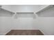 Spacious walk-in closet with ample shelving and hanging rods at 8391 W Mantle Way, Florence, AZ 85132