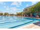Community lap pool with lanes and lounge chairs at 8391 W Mantle Way, Florence, AZ 85132