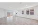 Spacious living room with tile flooring and sliding glass doors at 8391 W Mantle Way, Florence, AZ 85132