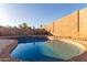 Kidney-shaped pool with brick coping at 8402 W Monte Vista Rd, Phoenix, AZ 85037