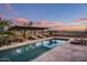 Relaxing pool with mountain views and sunset colors at 8741 E Silver Saddle Dr, Carefree, AZ 85377