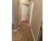 Bright hallway with wood-look tile flooring at 8816 W Palmaire Ave, Glendale, AZ 85305