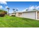 Spacious backyard with large patio and grassy area at 10404 W Audrey Dr, Sun City, AZ 85351