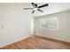 Bright bedroom with wood floors and ceiling fan at 10404 W Audrey Dr, Sun City, AZ 85351