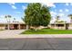 Front view of the house with driveway and landscaping at 10404 W Audrey Dr, Sun City, AZ 85351