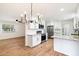 Remodeled kitchen with white cabinets, stainless steel appliances, and quartz countertops at 10404 W Audrey Dr, Sun City, AZ 85351