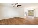 Bright living room with hardwood floors and a ceiling fan at 10404 W Audrey Dr, Sun City, AZ 85351