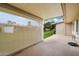 Covered patio with retractable shade and view of yard at 10404 W Audrey Dr, Sun City, AZ 85351