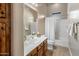 Clean bathroom with a tub, shower, and wood cabinets at 10821 E Tusayan Trl, Scottsdale, AZ 85255