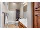 Clean bathroom with shower/tub combo and wood vanity at 10821 E Tusayan Trl, Scottsdale, AZ 85255