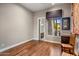 Light and airy bedroom with hardwood floors and access to bathroom at 10821 E Tusayan Trl, Scottsdale, AZ 85255