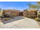 Single-story home with stone accents and desert landscaping at 10821 E Tusayan Trl, Scottsdale, AZ 85255
