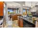 Open kitchen with granite counters and custom cabinetry at 10821 E Tusayan Trl, Scottsdale, AZ 85255
