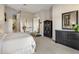 Main bedroom with a dresser and access to bathroom and walk-in closet at 10821 E Tusayan Trl, Scottsdale, AZ 85255