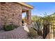Stone patio with walkway and desert landscaping at 10821 E Tusayan Trl, Scottsdale, AZ 85255