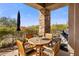 Relaxing patio with table, chairs, and built-in grill at 10821 E Tusayan Trl, Scottsdale, AZ 85255