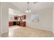 Dining area with tile floor and view into kitchen at 12062 W Salter Dr, Sun City, AZ 85373