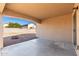 Covered patio with fire pit and access to backyard at 12062 W Salter Dr, Sun City, AZ 85373