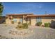 Tan building exterior with arched windows and nicely landscaped grounds at 13082 N 100Th Ave, Sun City, AZ 85351