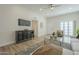 Open living room showcasing a flat-screen TV and ample natural light at 13082 N 100Th Ave, Sun City, AZ 85351