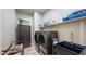 Laundry room with washer, dryer, and utility sink at 14572 W Medlock Dr, Litchfield Park, AZ 85340