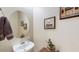 Powder room with single sink vanity at 14572 W Medlock Dr, Litchfield Park, AZ 85340