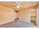 Bright bedroom with ceiling fan, carpet, and walk-in closet at 16445 E Segundo Dr, Fountain Hills, AZ 85268