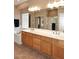 Bathroom with double vanity, large mirror, and bathtub at 23307 N 71St Dr, Glendale, AZ 85310