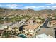 Aerial view showing house, pool, and surrounding neighborhood in mountain setting at 2801 W Silver Fox Way, Phoenix, AZ 85045