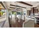 Elegant dining area with a rustic wood table and modern lighting at 30138 N 133Rd Ln, Peoria, AZ 85383