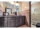 Bathroom with double vanity and a shower at 321 S 172Nd Dr, Goodyear, AZ 85338