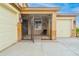 Ornate wrought iron gate leading to a covered entryway at 321 S 172Nd Dr, Goodyear, AZ 85338