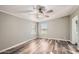 Bright bedroom with ceiling fan and wood-look flooring at 37032 N 12Th St, Phoenix, AZ 85086