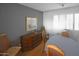 Dining room with wood buffet and seating for four at 4716 E Delta Ave, Mesa, AZ 85206