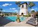 Inviting community pool with lounge chairs and surrounding plants at 6701 N Scottsdale Rd # 24, Scottsdale, AZ 85250