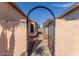 Pathway leading to the backyard through an arched gate at 7318 W Greer Ave, Peoria, AZ 85345