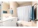 Clean bathroom with tub shower, and updated vanity at 7318 W Greer Ave, Peoria, AZ 85345