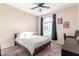 Spacious bedroom with carpeted floor and ceiling fan at 7318 W Greer Ave, Peoria, AZ 85345