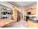 Kitchen with wood cabinets, granite countertops, and stainless steel appliances at 7318 W Greer Ave, Peoria, AZ 85345
